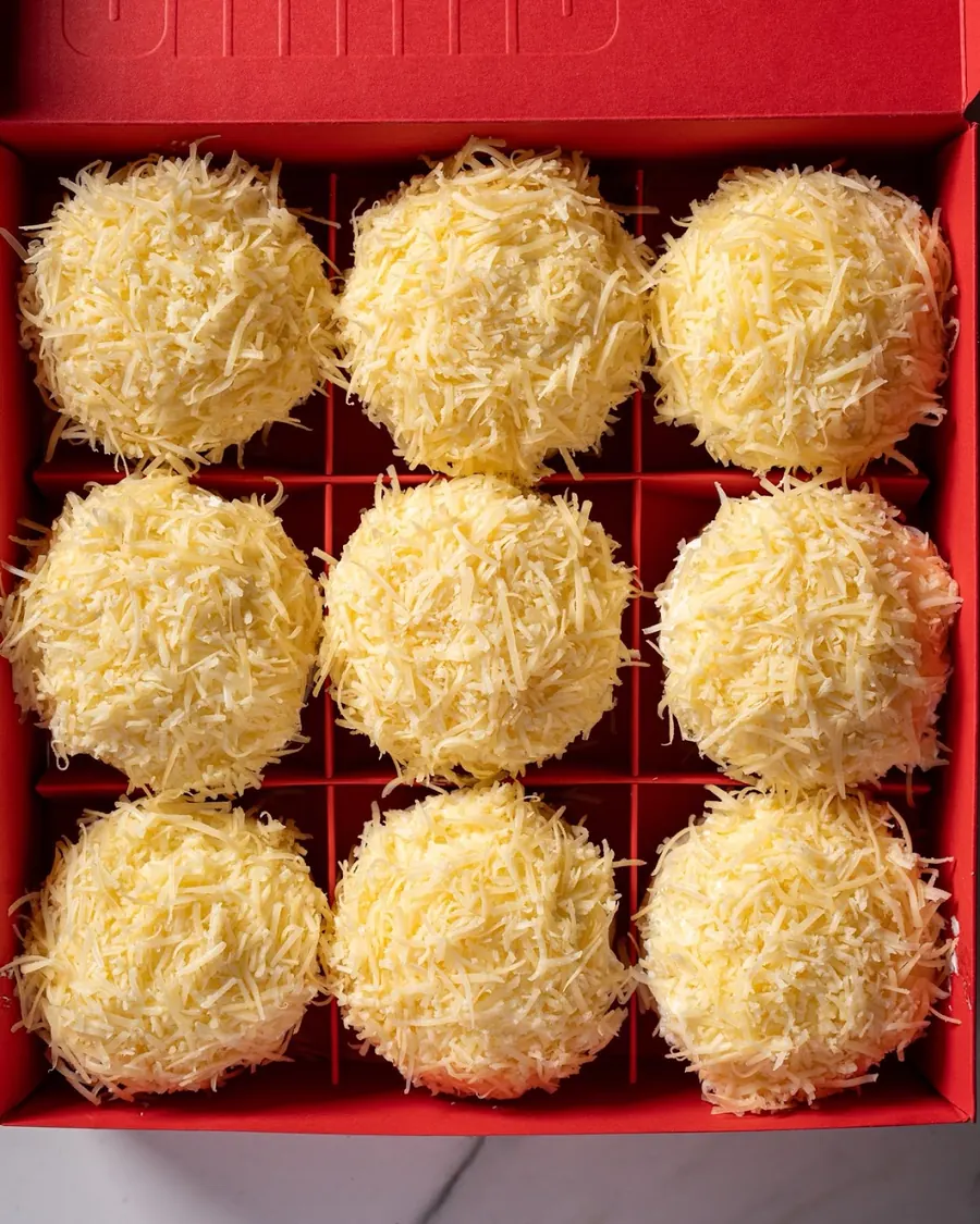 A full red box of SHUKR ensaymadas from above