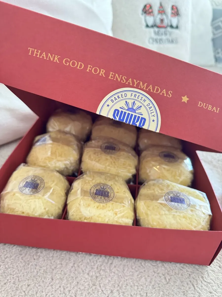 SHUKR box lid reading Thank God for Ensaymadas, Dubai